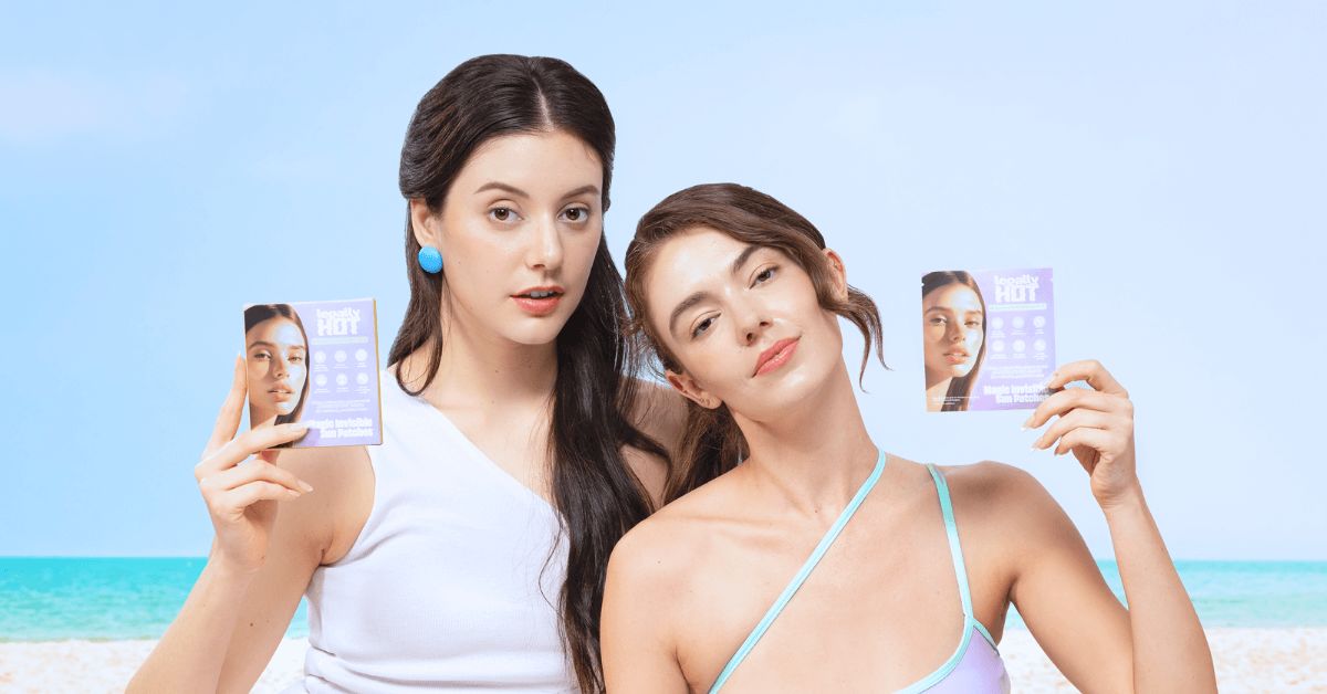Two models showcasing 12-Hour Invisible UPF 50+ Sun Patches at the beach, highlighting sun protection and skin safety.